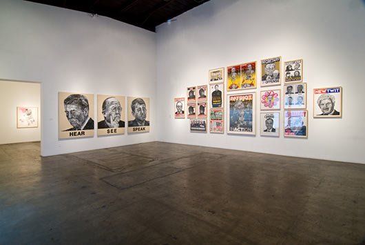 A large room with a lot of paintings on the wall.