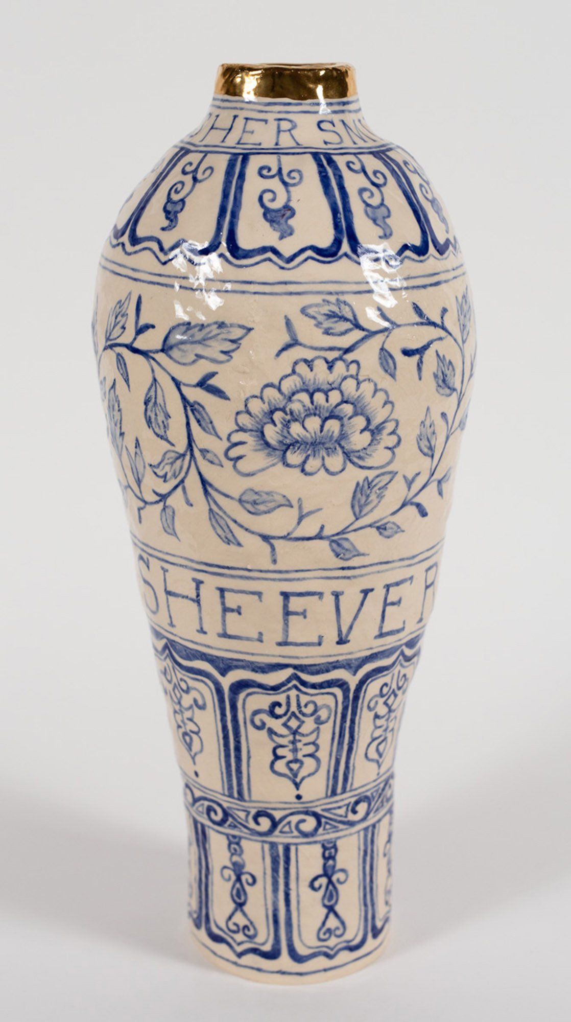 A blue and white vase with the word heeve on it