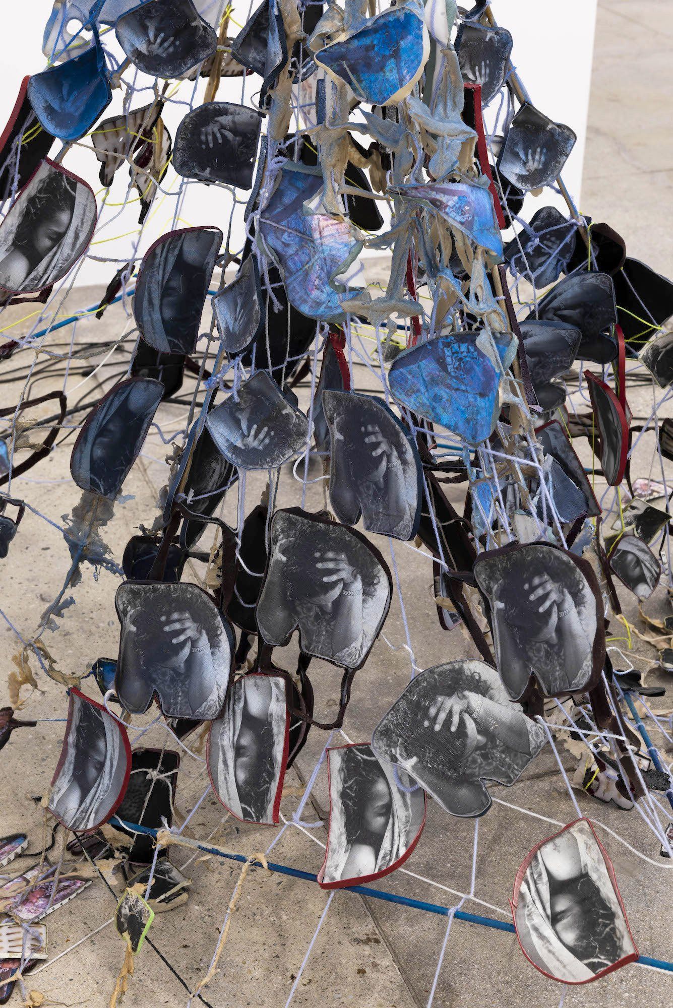 A bunch of glasses are hanging from a wire.