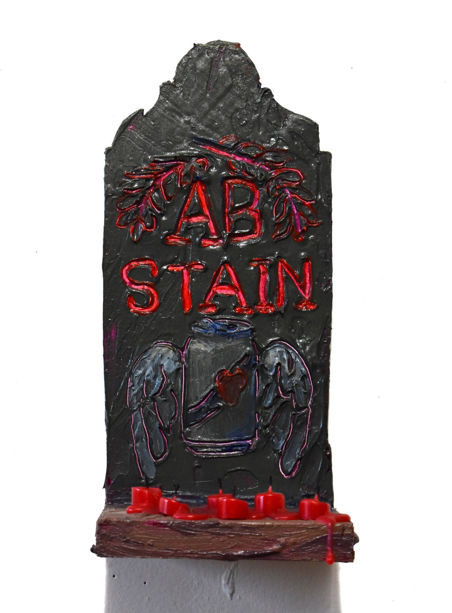 A gravestone with the word stain written on it
