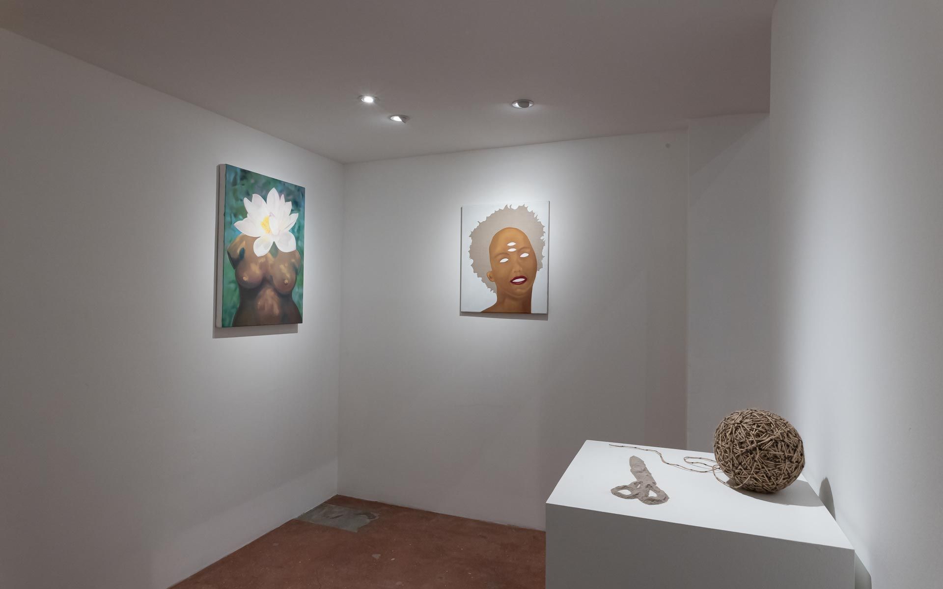 Small white house-shaped shelf sculpture, a painting of a figure and a red ladder on a white wall, and a ceramic vessel before a glass door. Installation view, Beryl Odette: Seaing, Track 16.