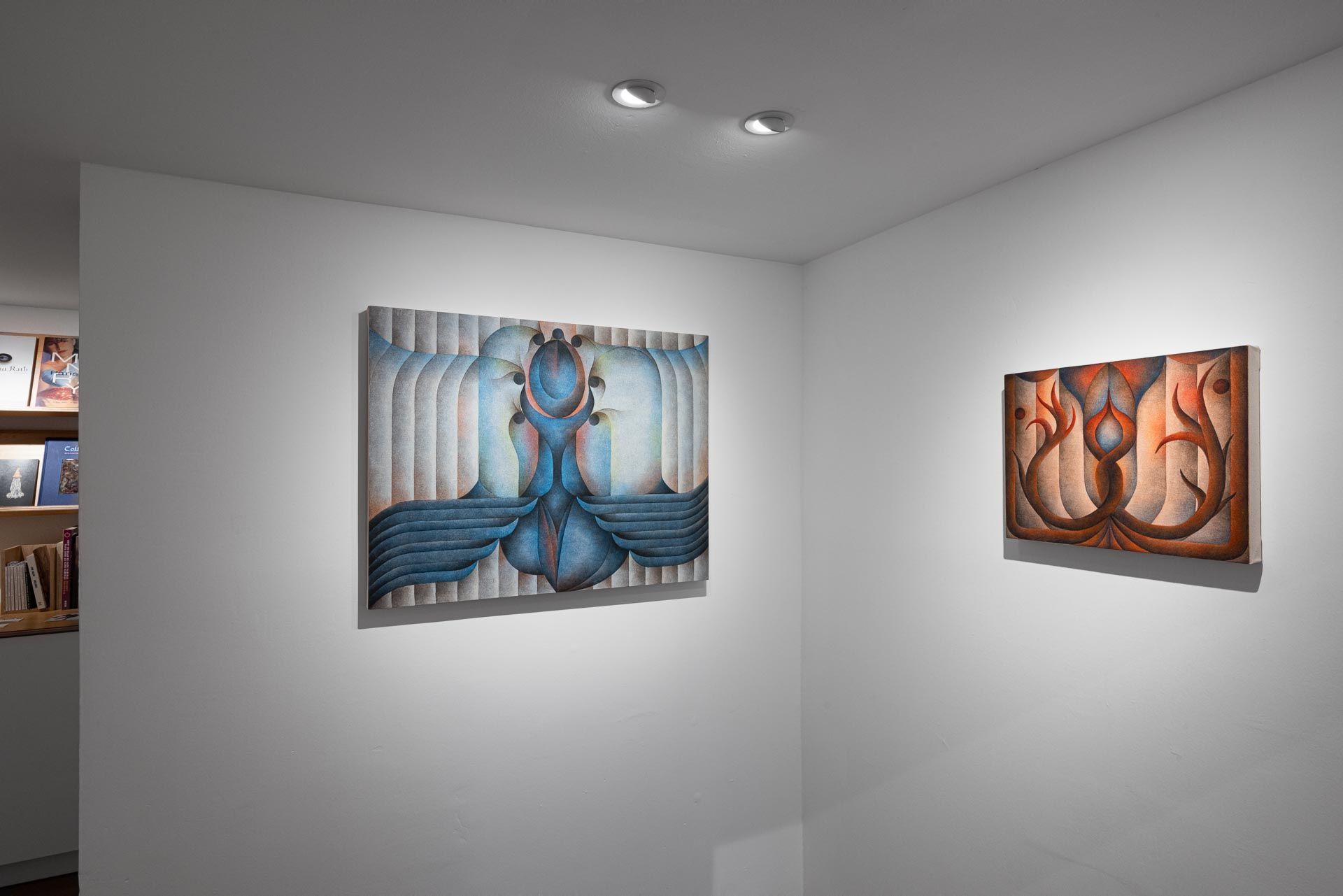 Gallery corner with a blue painting and an orange painting on adjoining walls. Installation view, Roberta Gentry: Blood Orange, Track 16, Los Angeles.