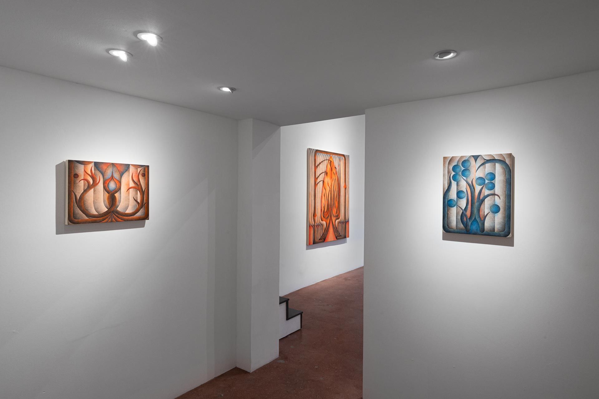 Three paintings in a white passage: two orange and one blue-and-white. Installation view, Roberta Gentry: Blood Orange, Track 16, Los Angeles.