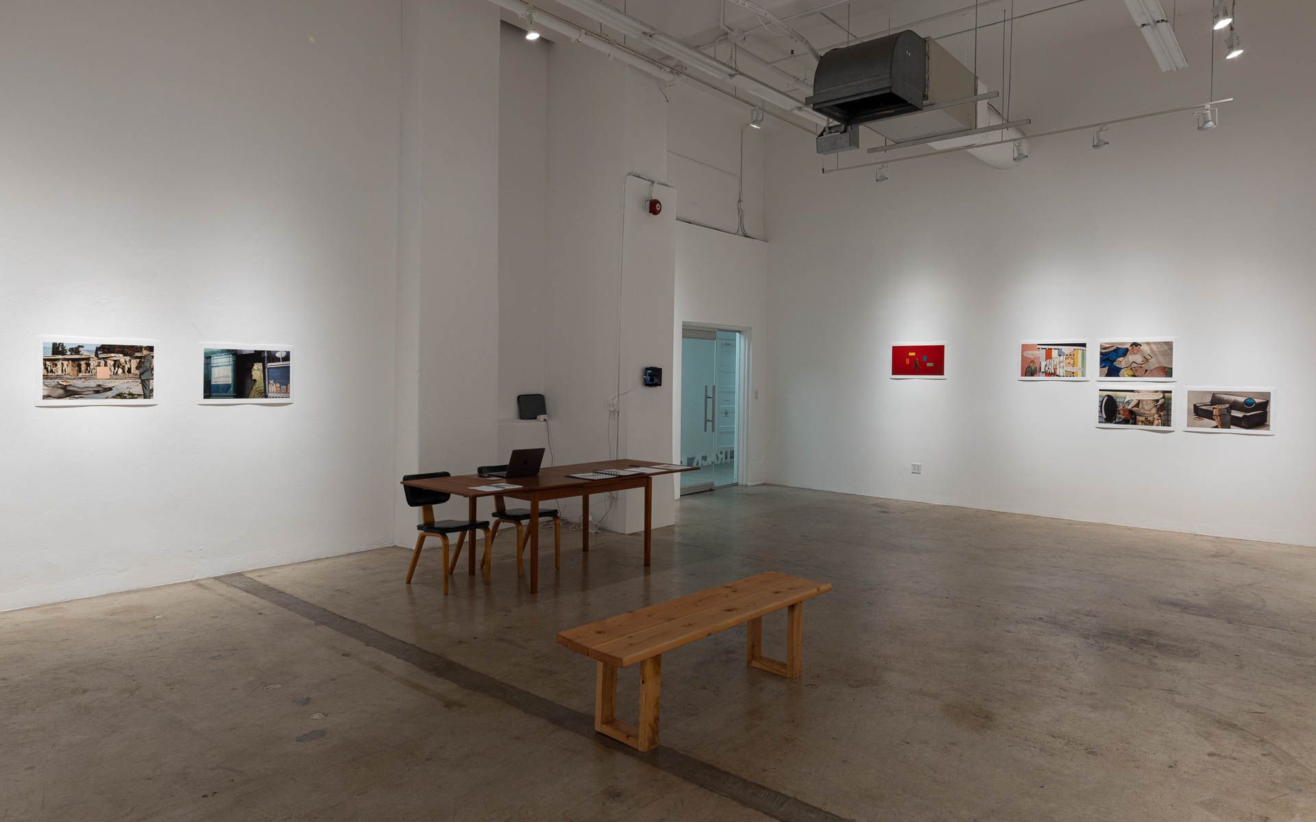 There is a table and chairs in the middle of the room.