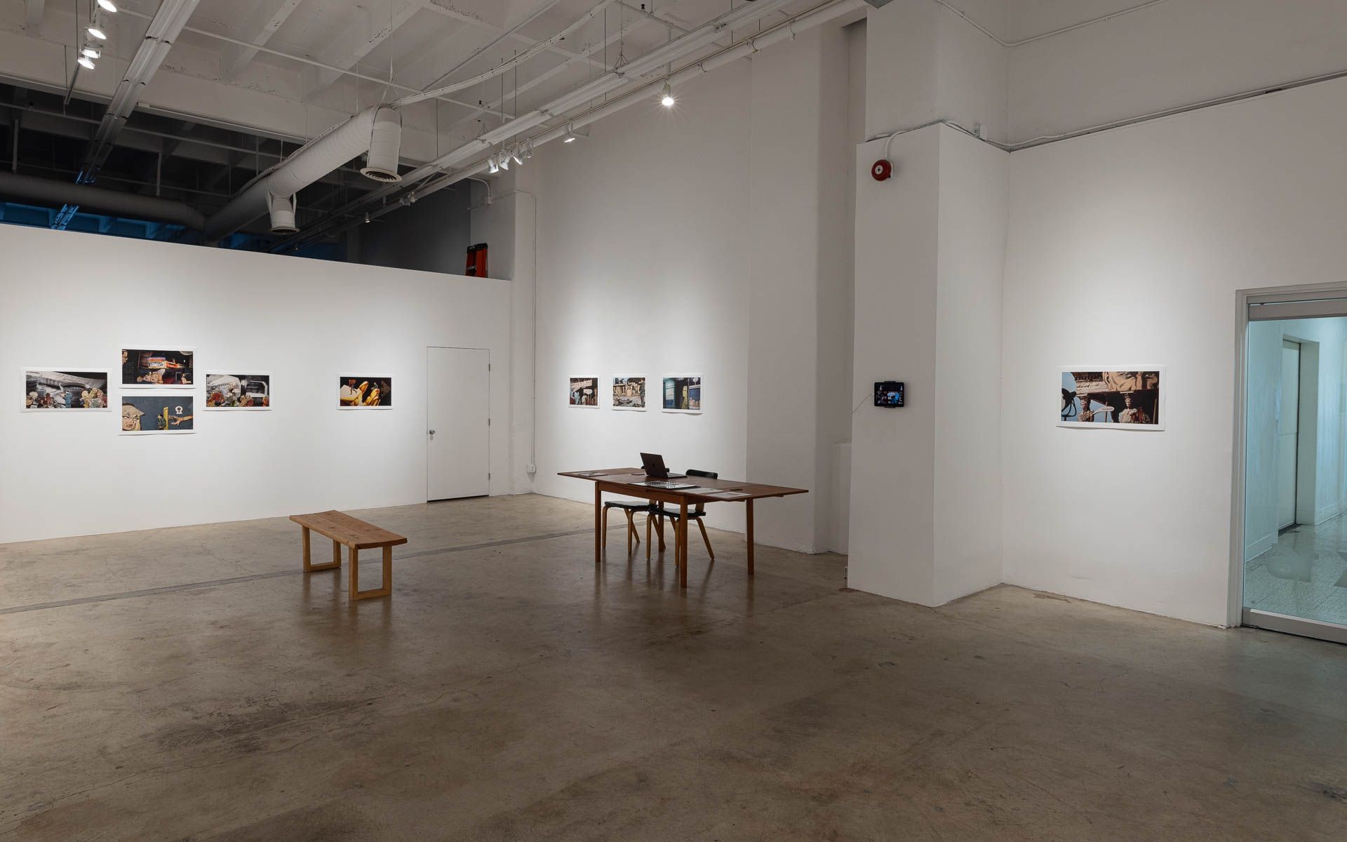 1920w.jpg Pairs and clusters of color collage prints, a red work at center, a table with chairs and a wooden bench on the concrete floor. Installation view, Lewis Klahr: Porcelain Gods, Track 16.