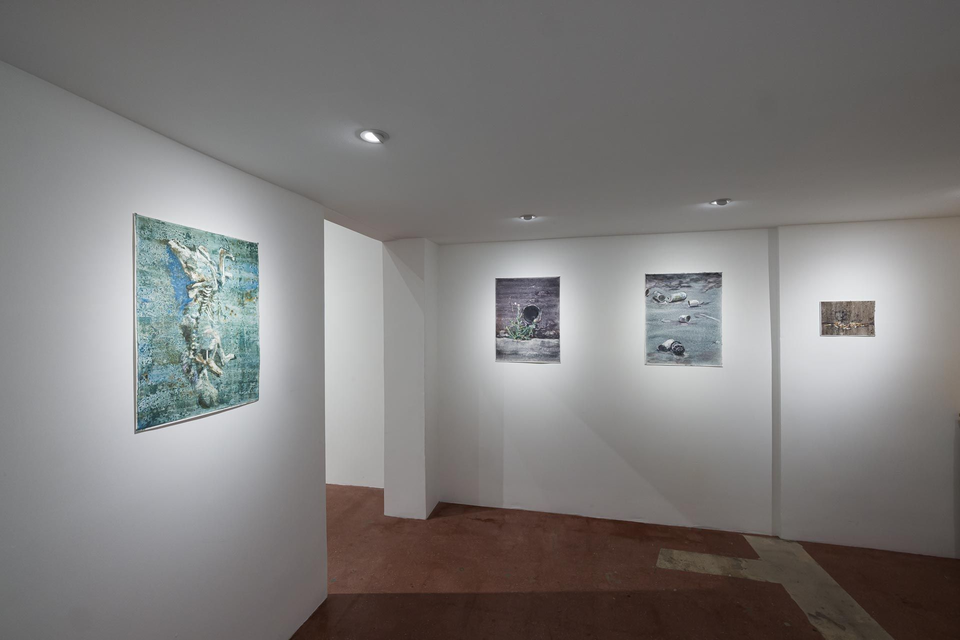 Large blue-green textured painting on a freestanding wall at left, and three small dark and gray paintings on the wall beyond. Installation view, Molly Segal: As We Grind Our Teeth To Dust, Track 16.