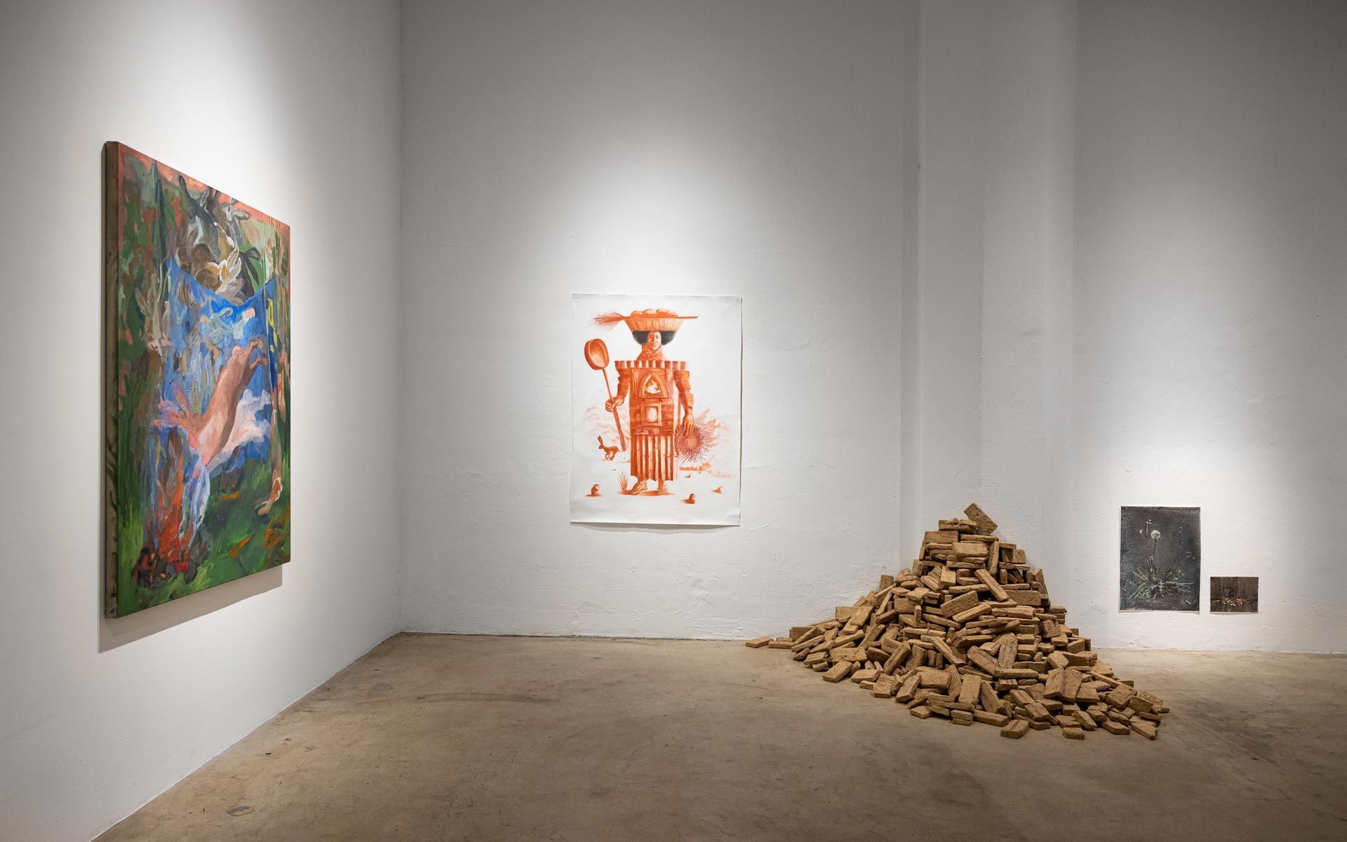 Gallery room with three wall artworks and a pile of wood chips on the floor. Praise the Dying Beauty art exhibition at Track 16 Downtown Los Angeles gallery. Curated by Galia Linn featuring sculpture, paintings and drawings. 