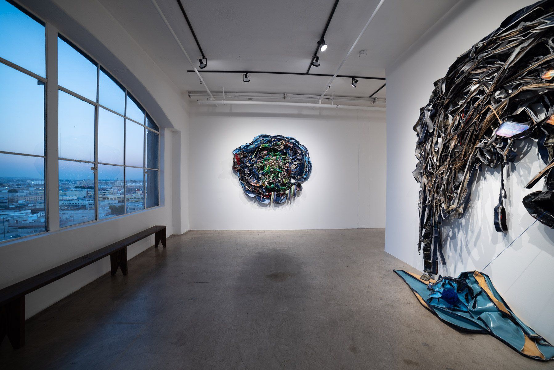 A large room with a large painting on the wall