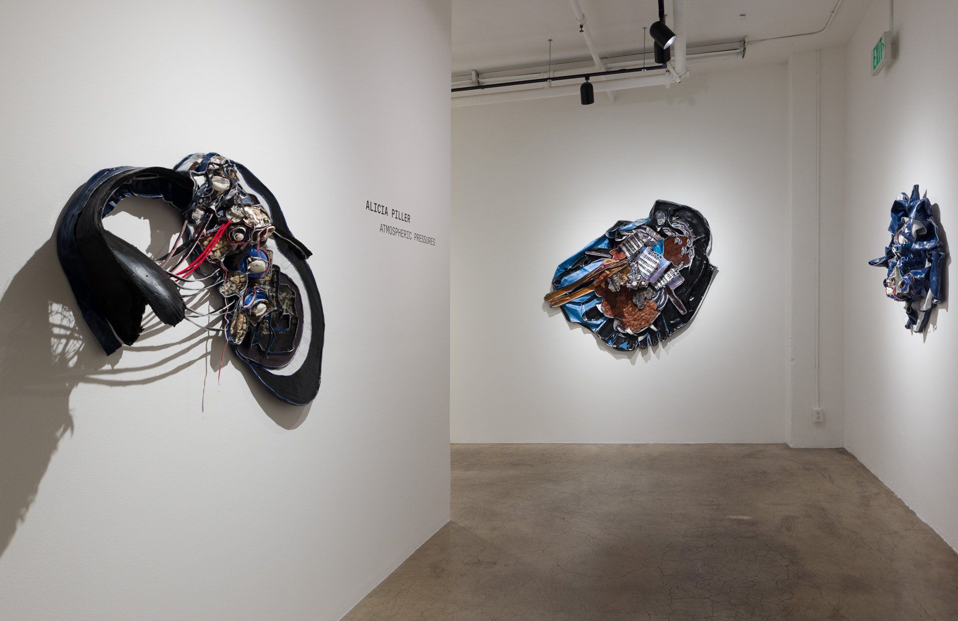 There are a lot of sculptures on the wall in this room.