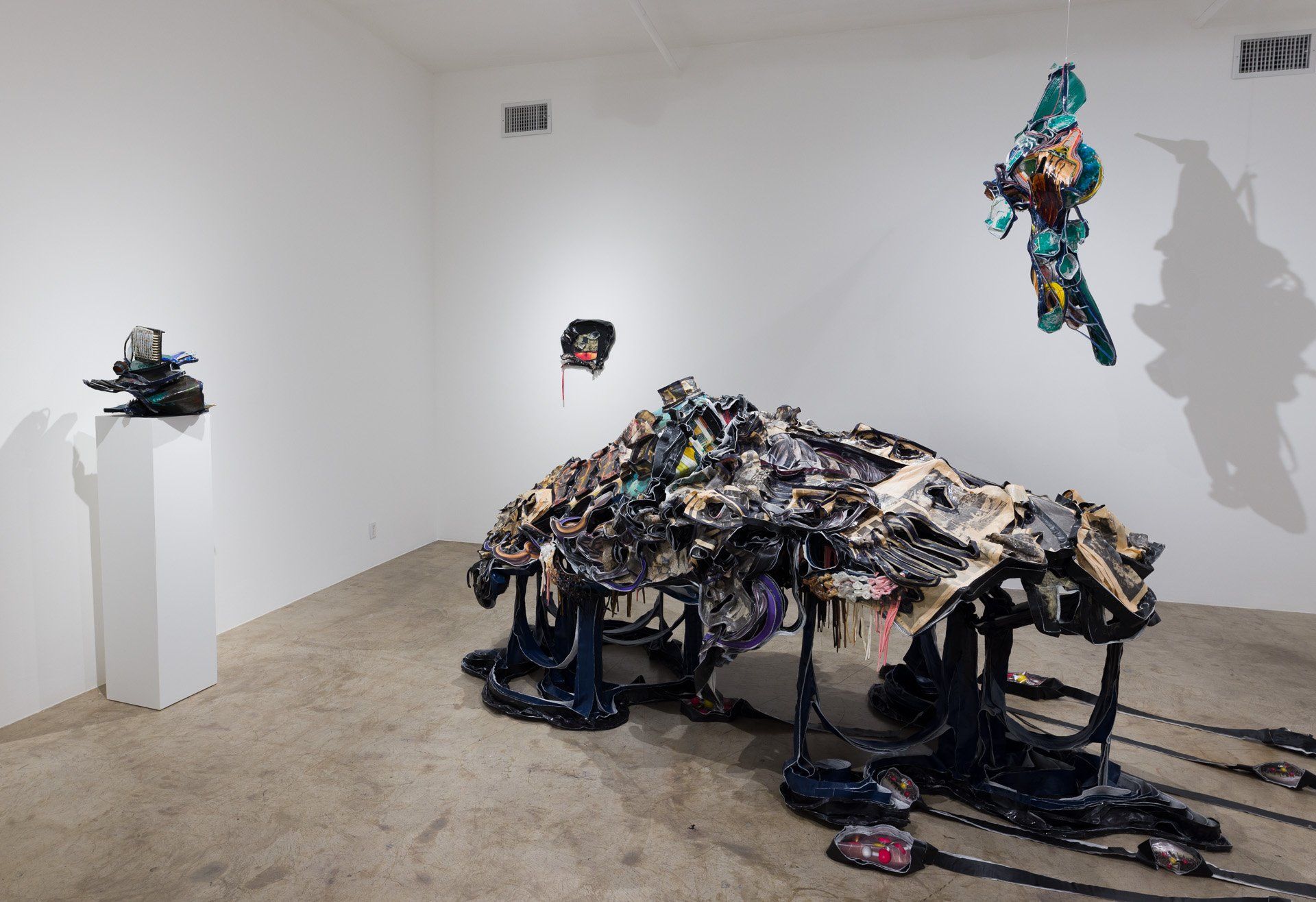 A room with a large sculpture in the middle of it