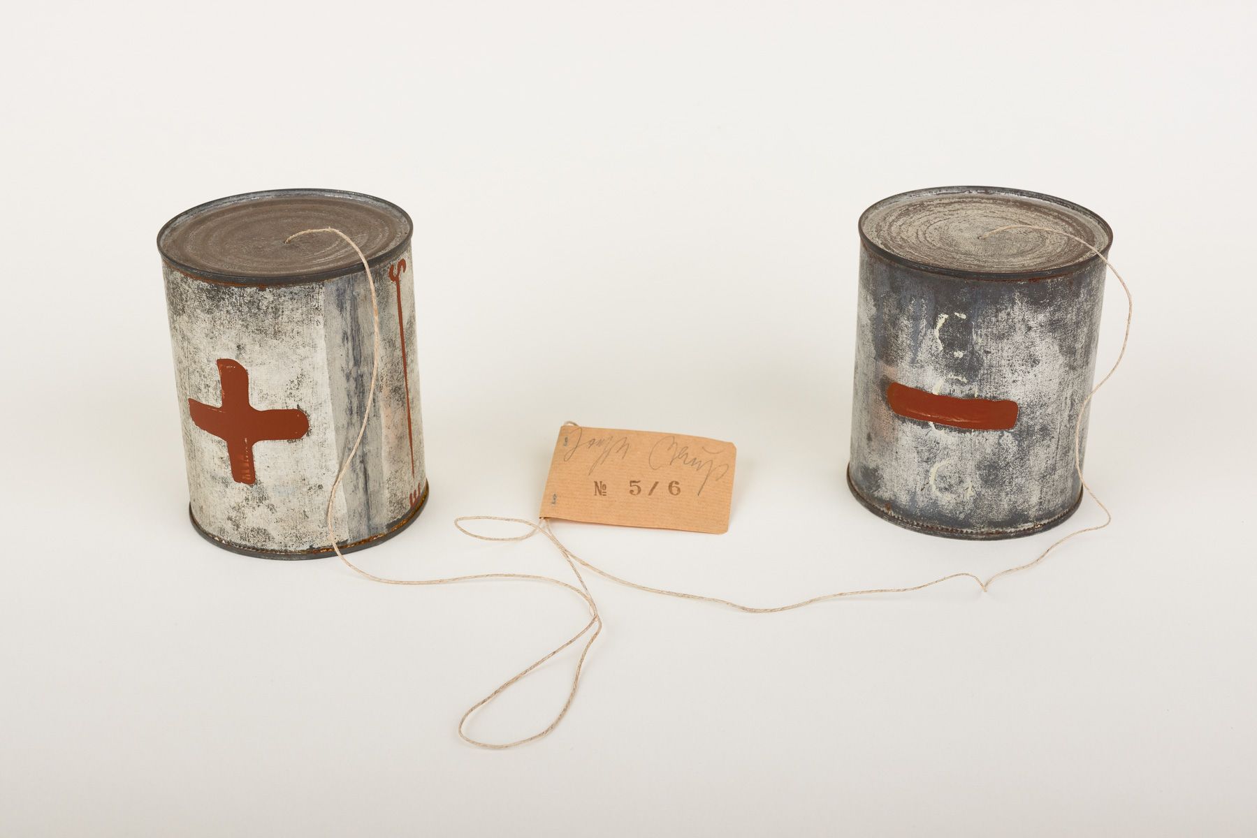 Cans: 5 7/8 x 4 7/8 inches diameter. String: 70 inches.
