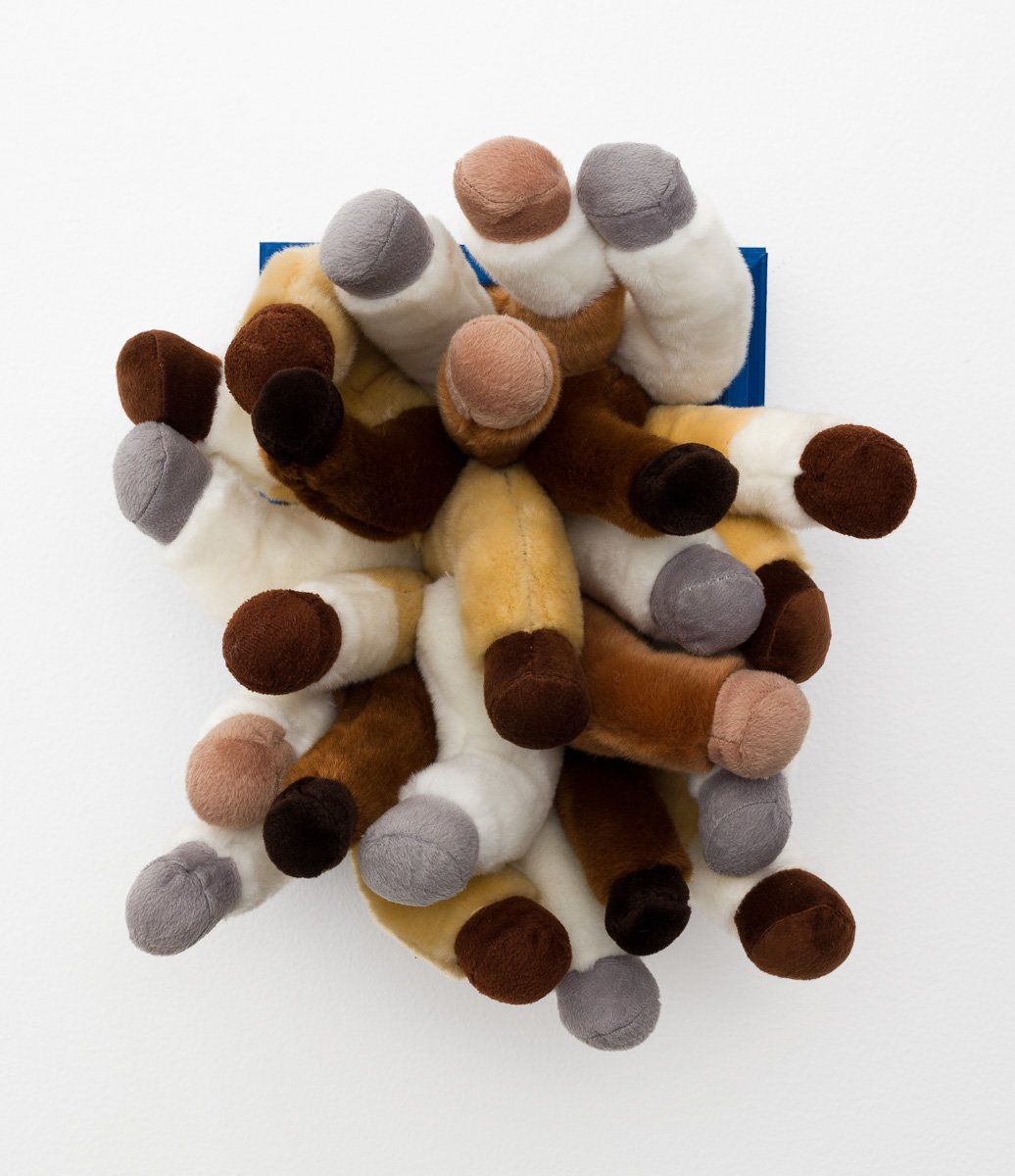 A bunch of stuffed animals are stacked on top of each other