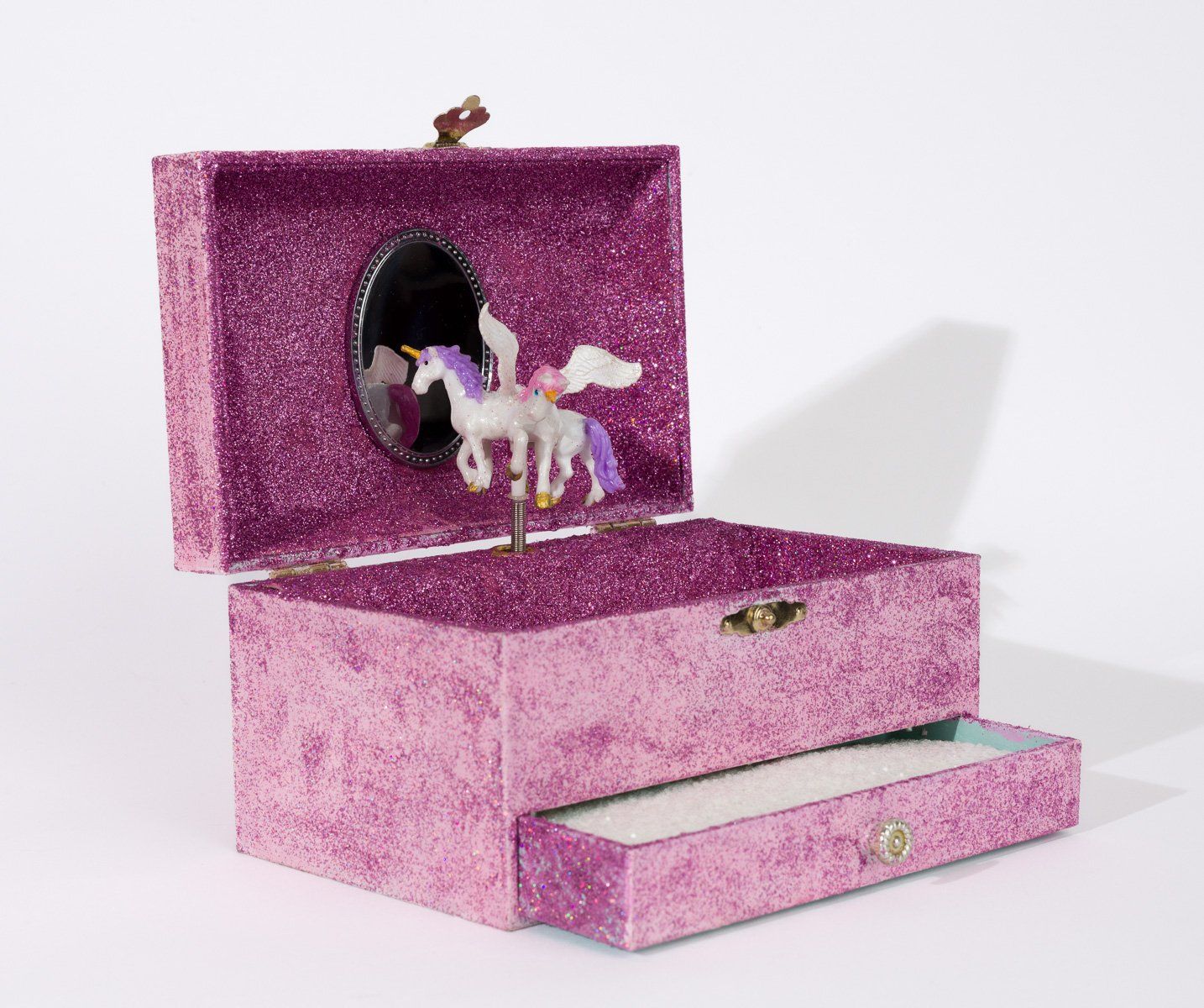 A purple jewelry box with a unicorn inside of it