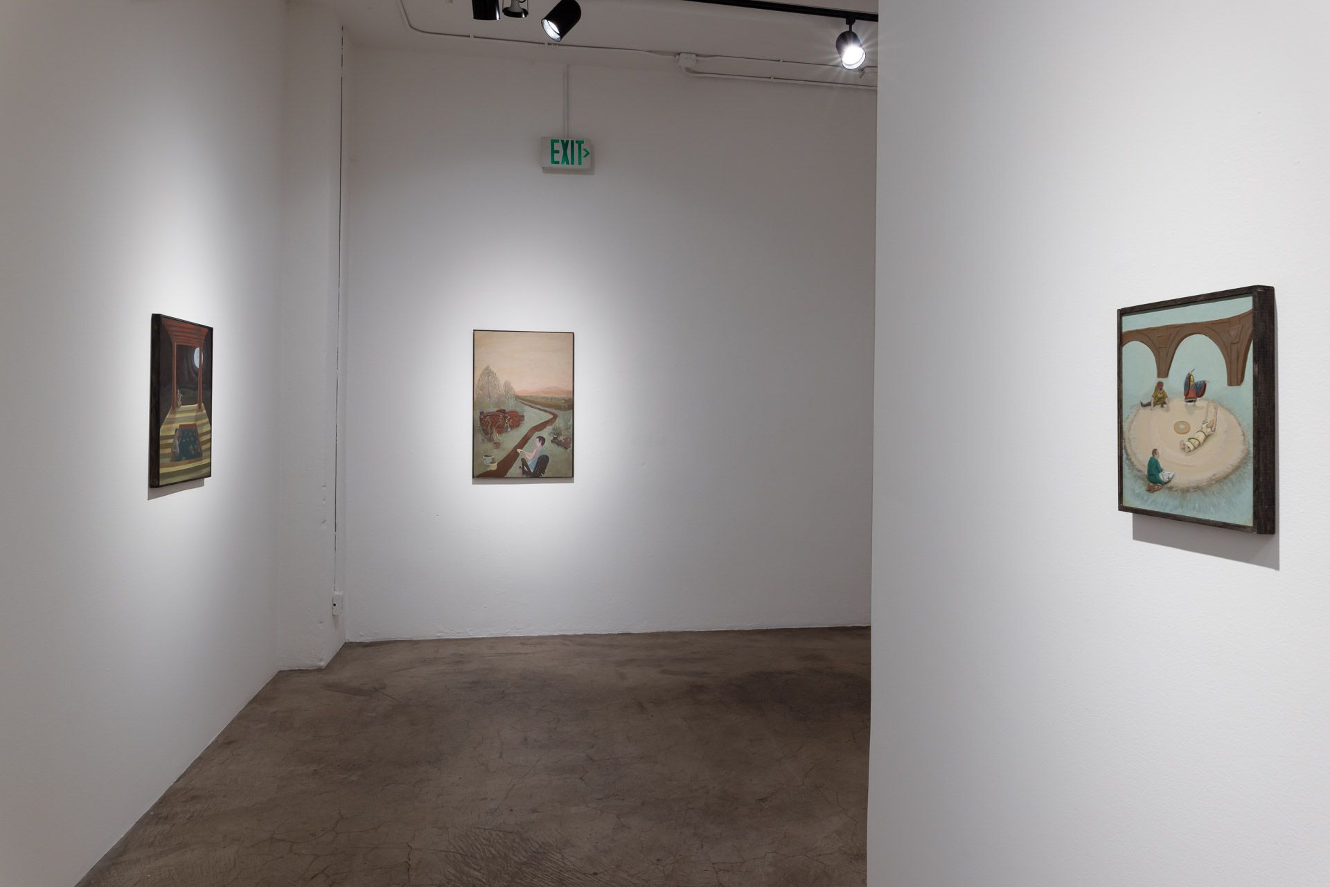 A room with a few paintings on the wall