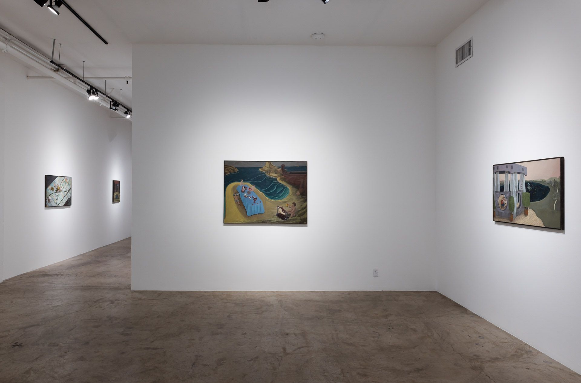 There are a lot of paintings on the wall in this room.