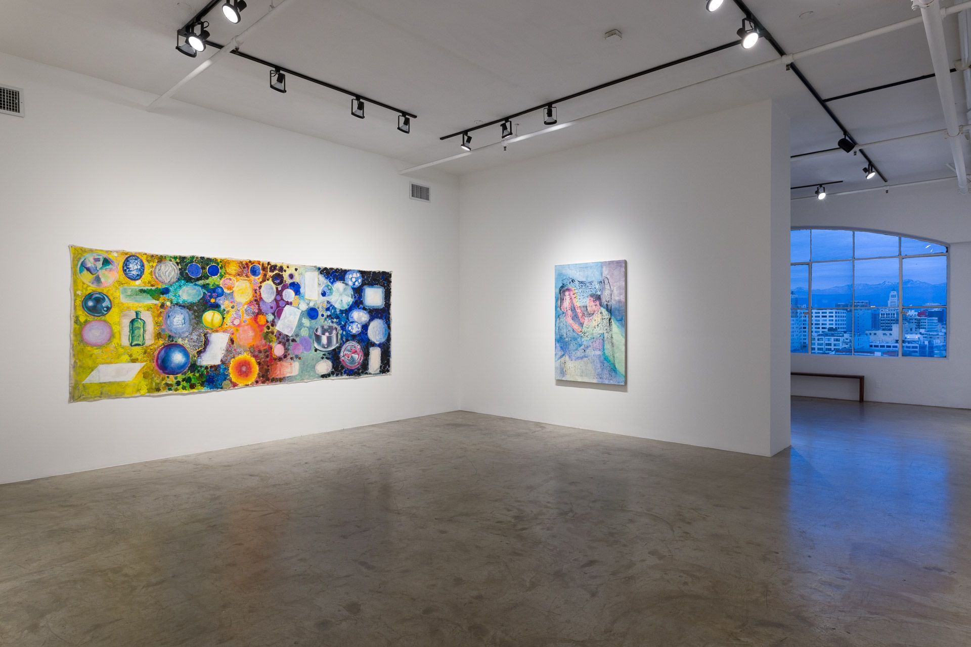 A large room with a lot of paintings on the wall.