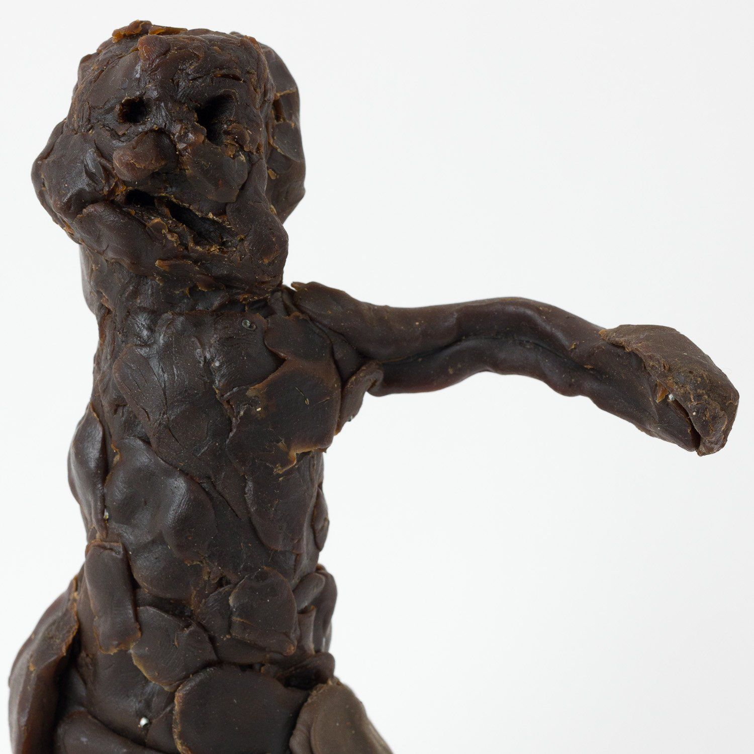 A close up of a statue of a man made of chocolate