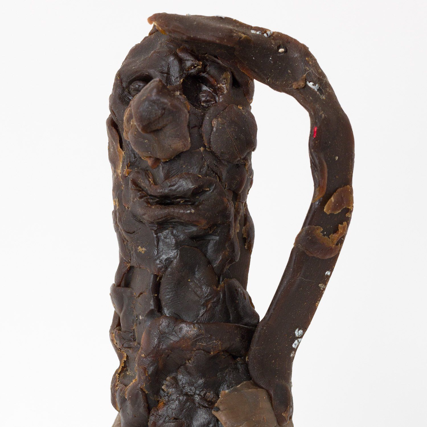 A close up of a sculpture with a face on it