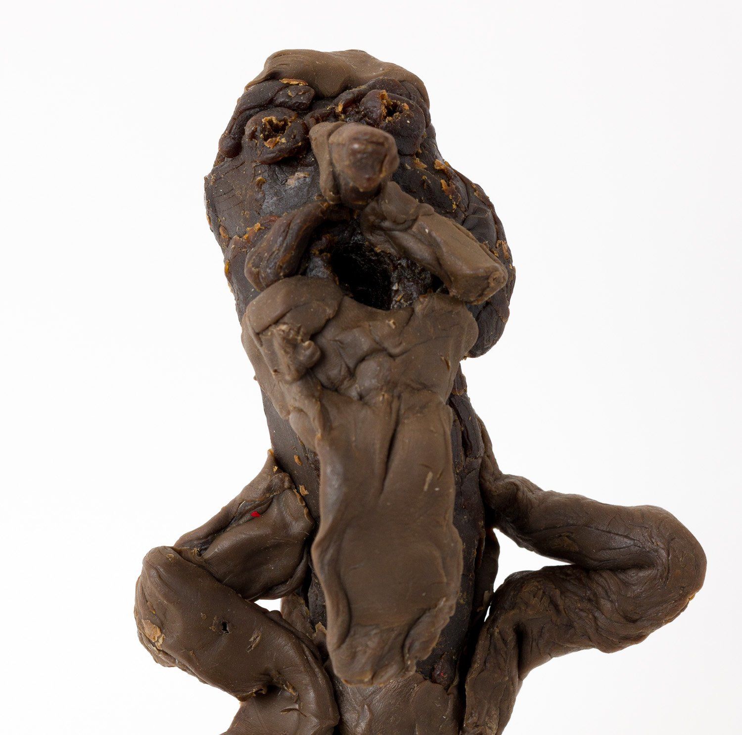 A statue of a person with a hole in their mouth