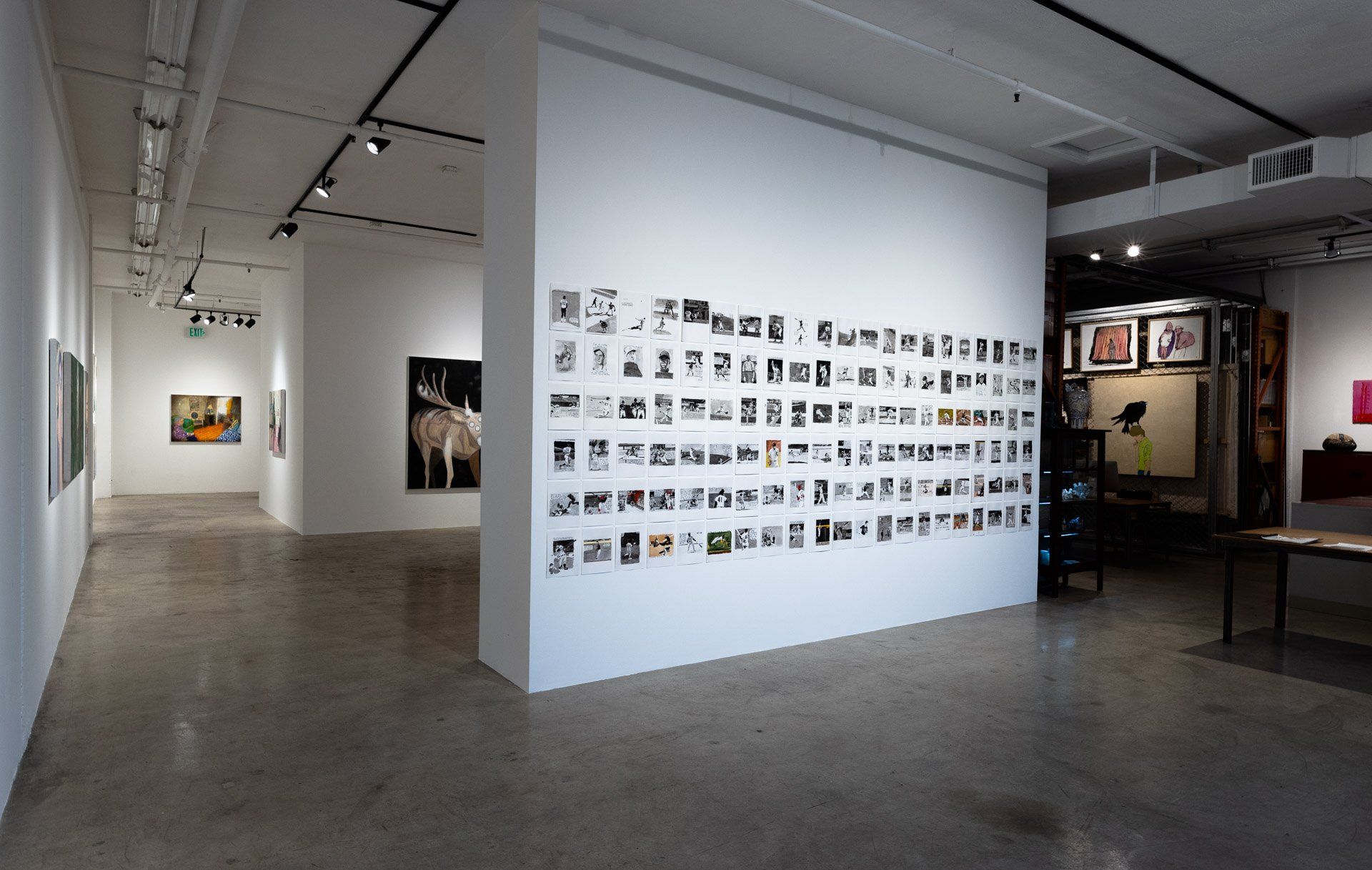A large room with a lot of paintings on the wall.
