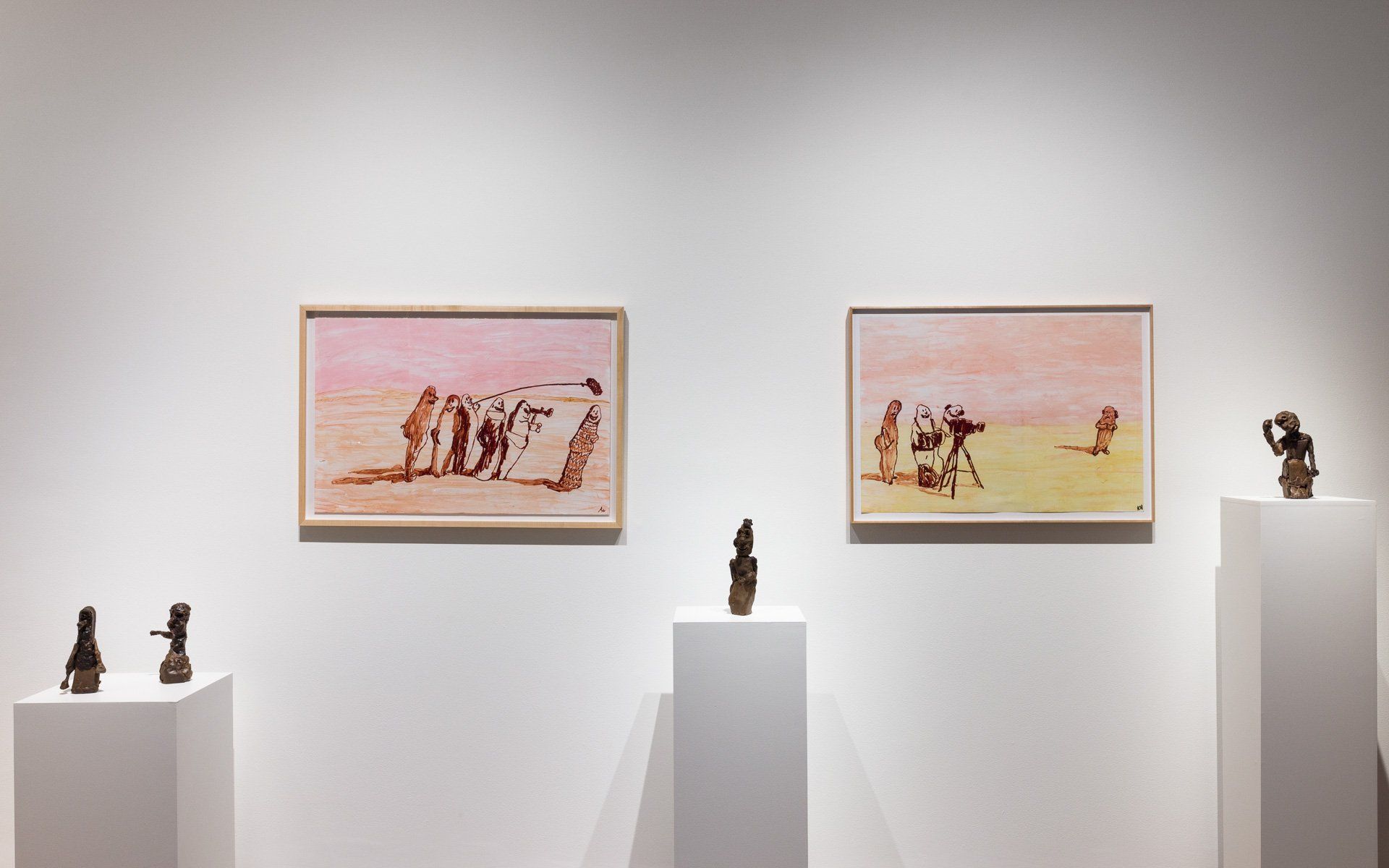 A row of paintings and sculptures on display in Track 16 Gallery.