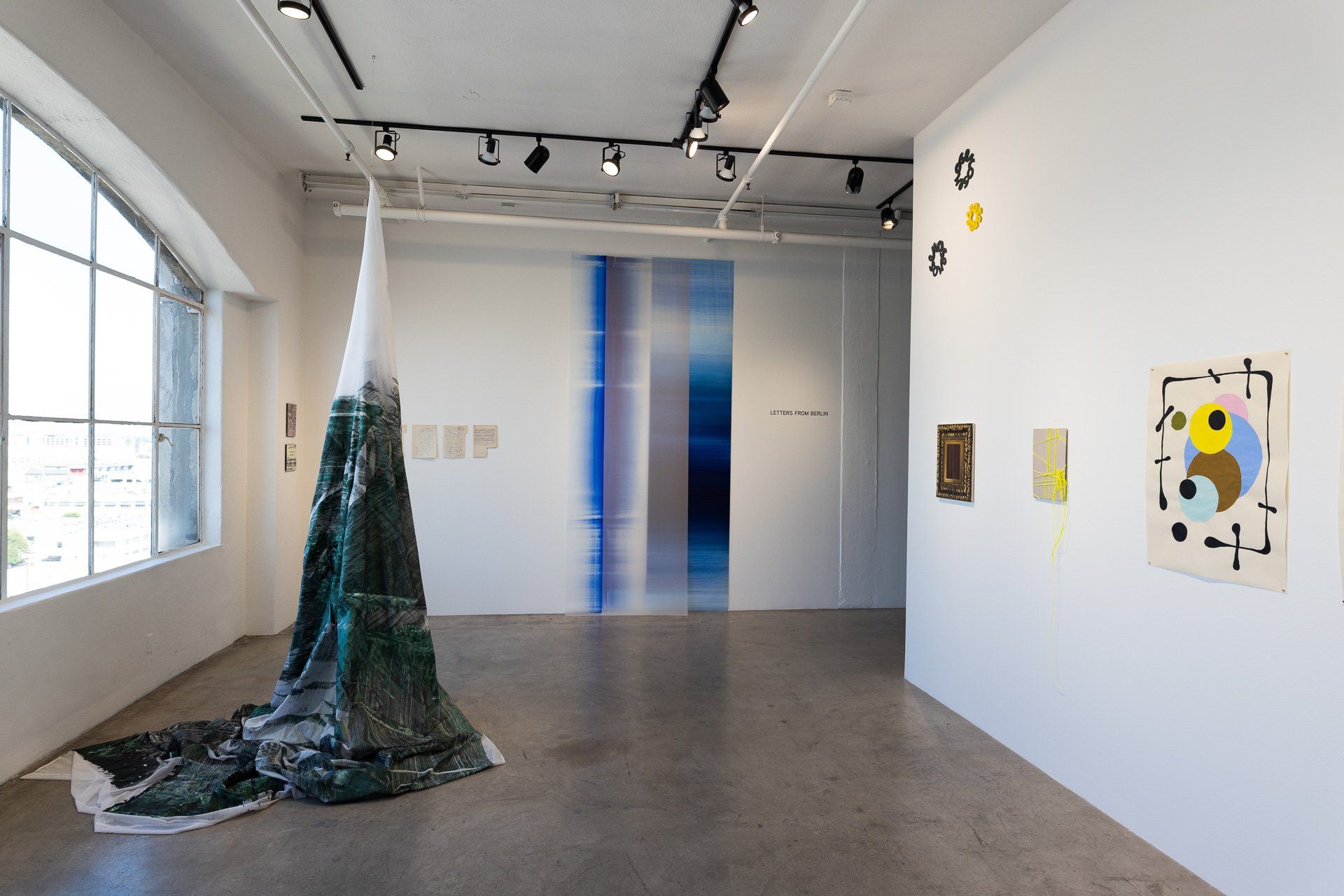 A large room with a volcano shaped sculpture in the middle of it.