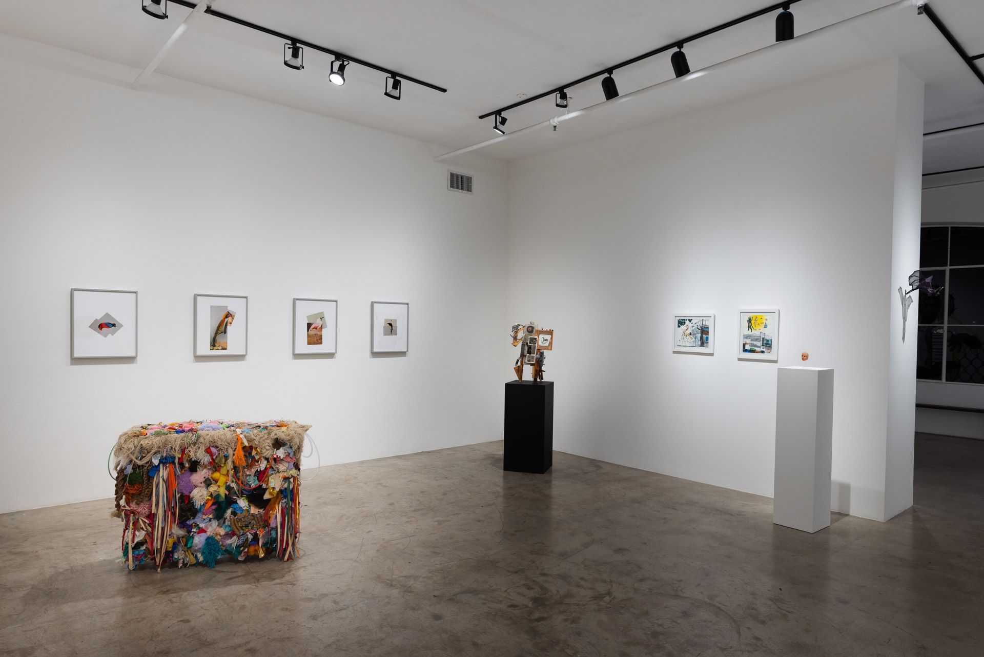 A room with a lot of paintings on the wall