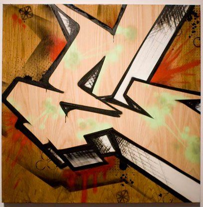 A painting of the letter k on a wooden surface