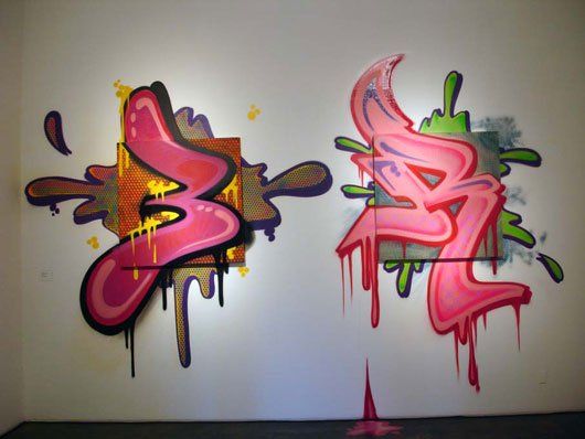 Two pieces of graffiti on a wall one of which has the letter a on it