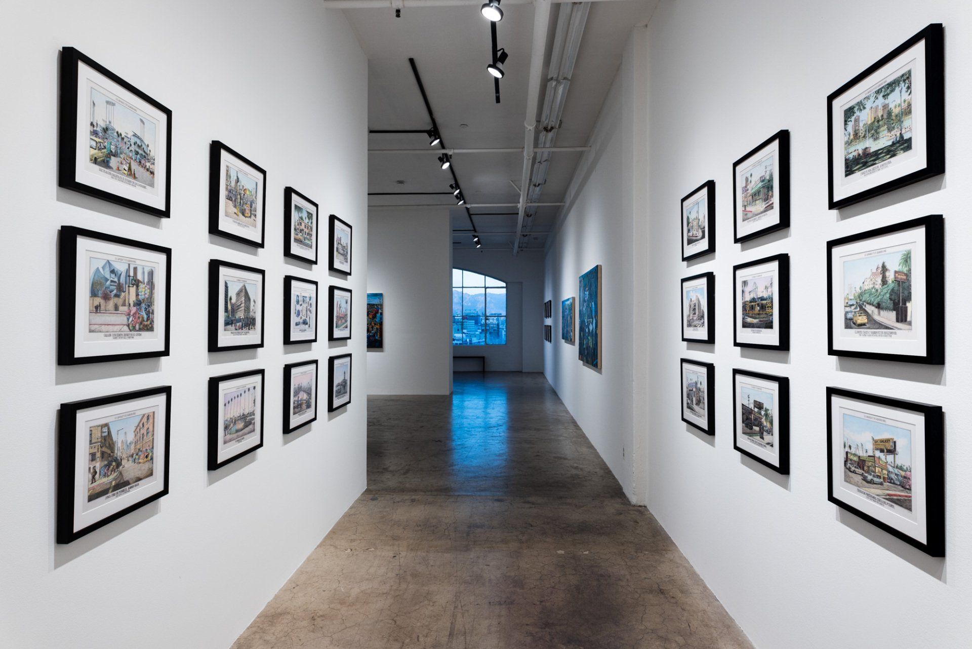 A long hallway with a lot of pictures on the wall.