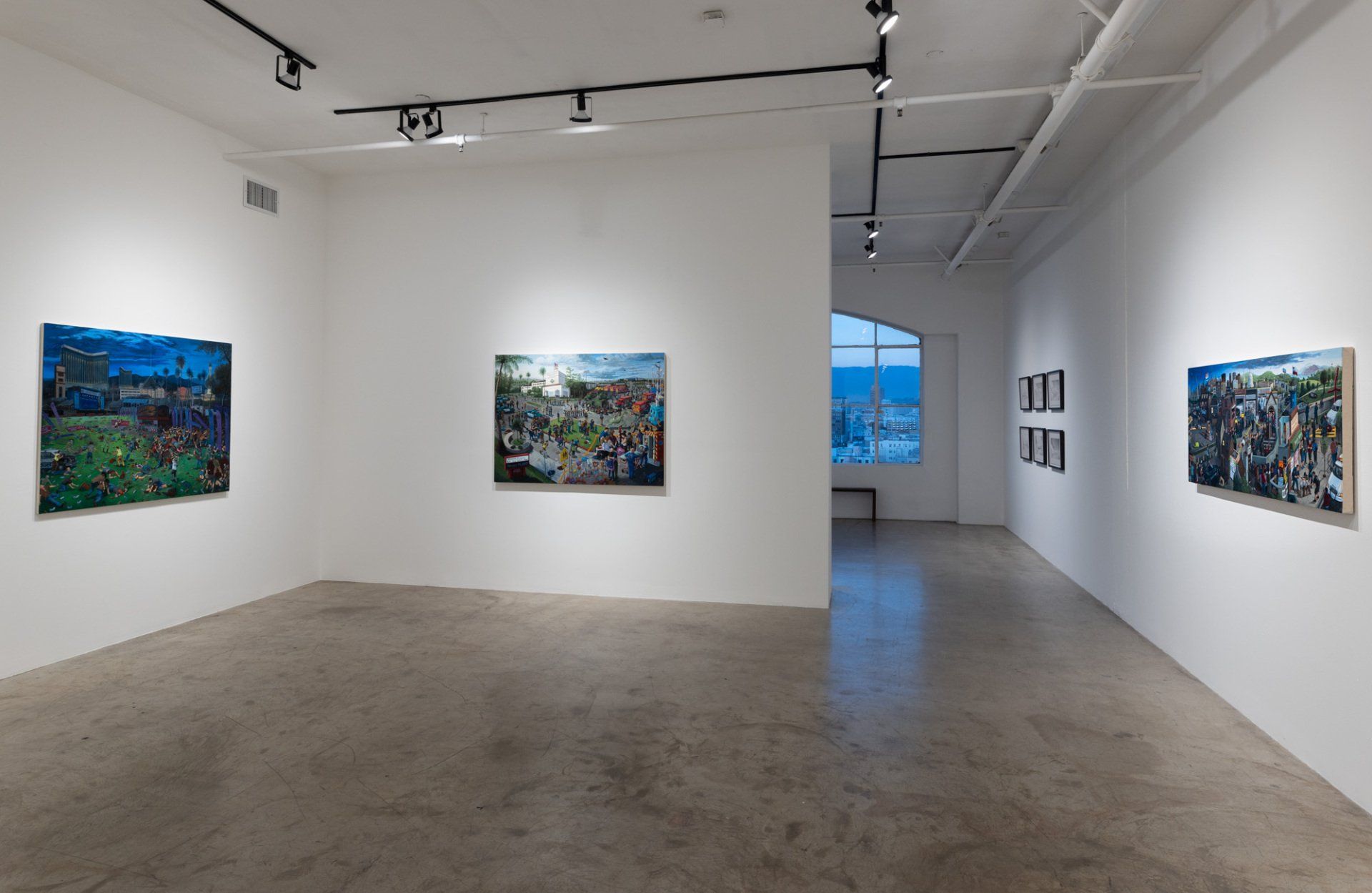A large room with a lot of paintings on the wall