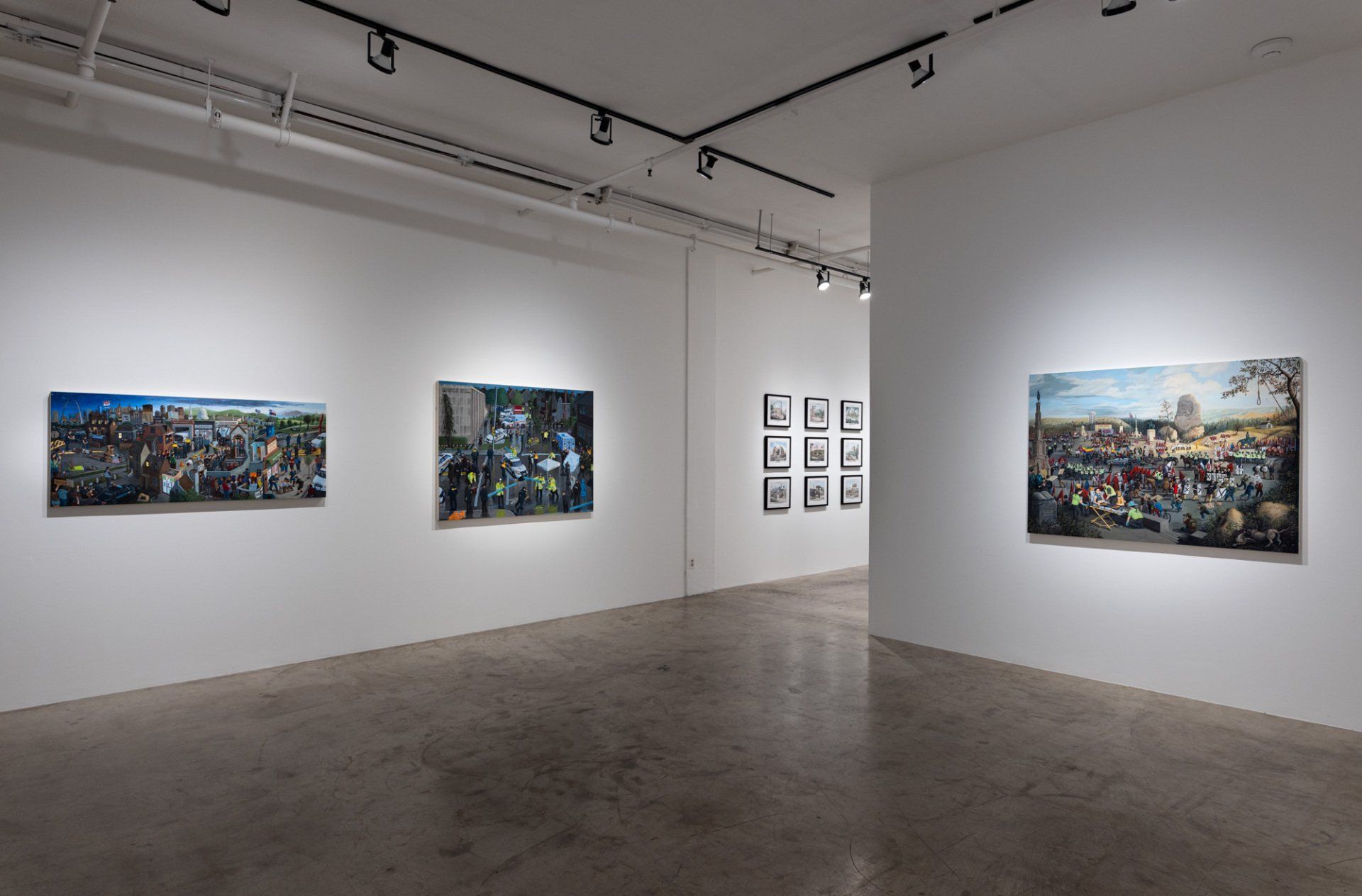 A large room with a lot of paintings on the wall.