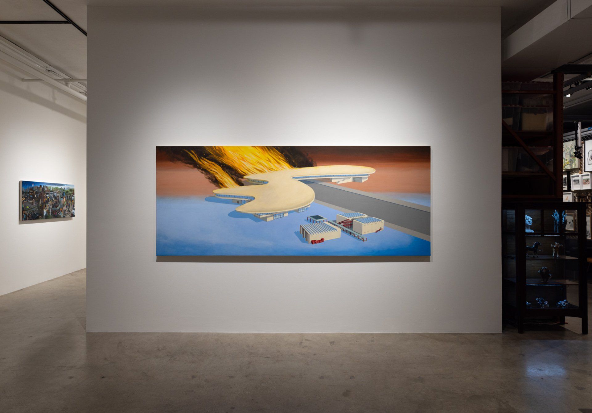 A large painting is hanging on a white wall in a museum.
