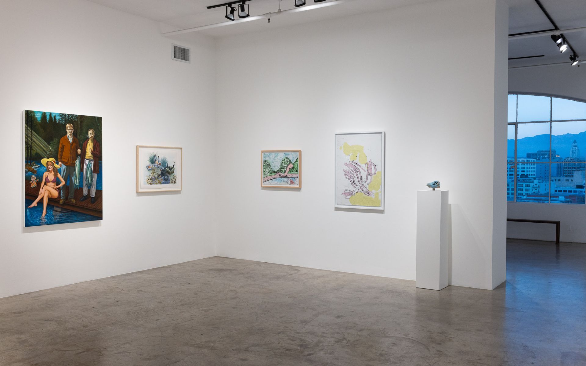 Art gallery with four framed paintings on white walls and a city view through the window. Summer Bullet Sings, an exhibition of thirty-five artists organized by gallery director Sean Meredith and curator Diana Sardaryan.