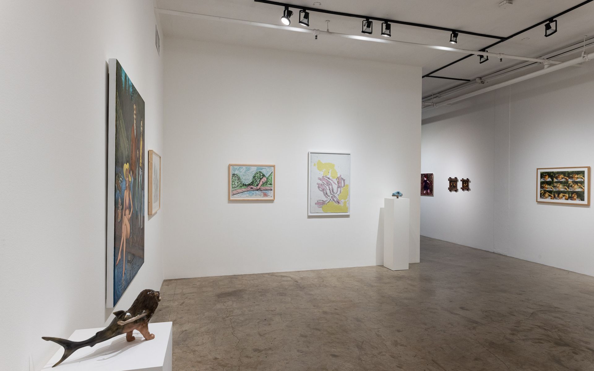 Modern art gallery with framed abstract paintings on white walls and a sculpture on a pedestal in the foreground. Summer Bullet Sings, an exhibition of thirty-five artists organized by gallery director Sean Meredith and curator Diana Sardaryan