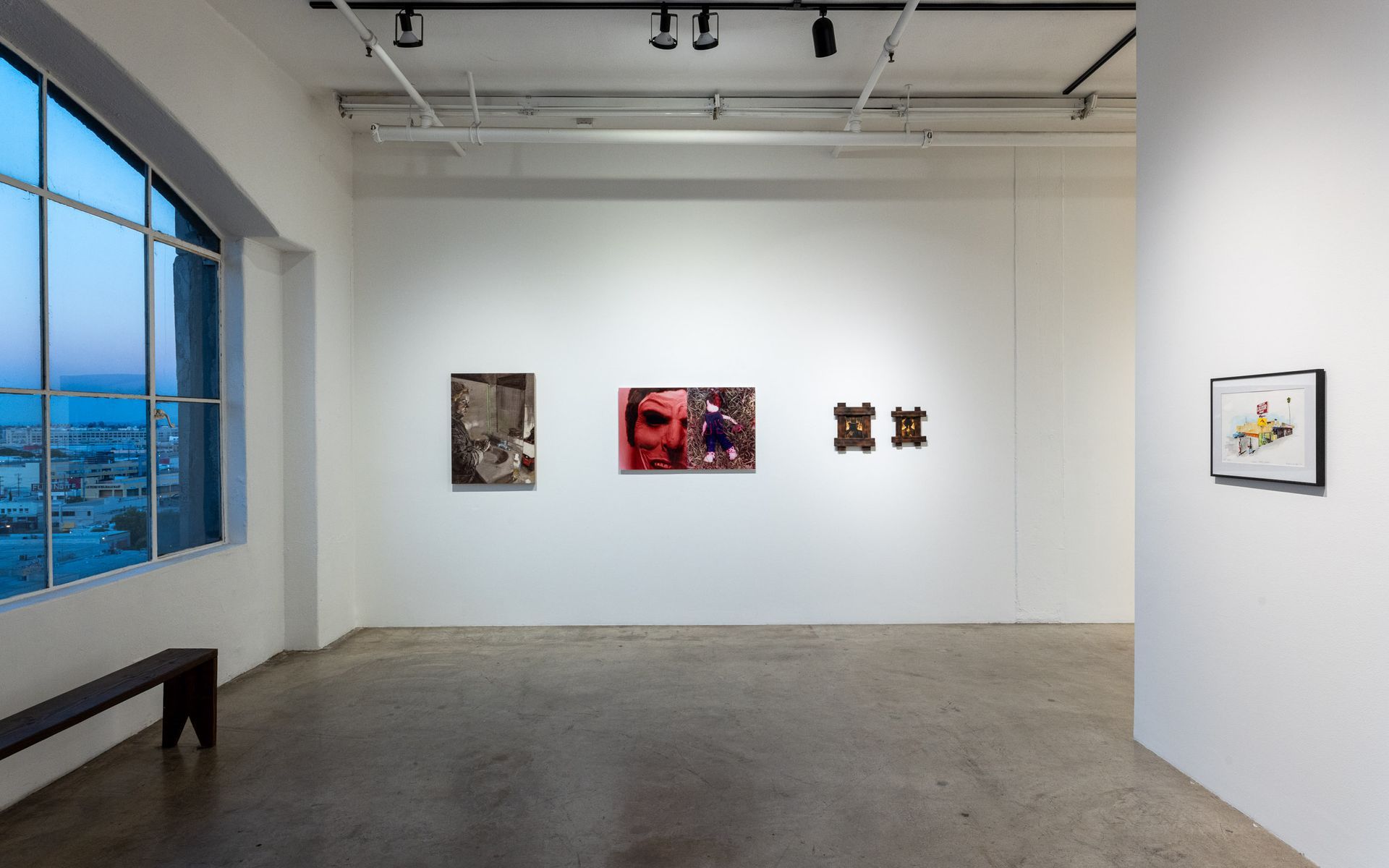 Minimal art gallery with framed abstract works on white walls and a large window view on the left. Summer Bullet Sings, an exhibition of thirty-five artists organized by gallery director Sean Meredith and curator Diana Sardaryan.