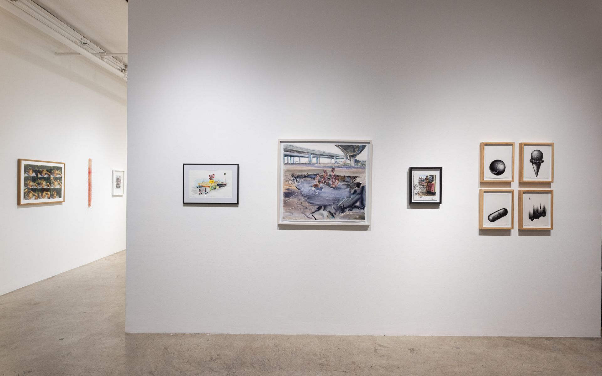 Art gallery with framed abstract and landscape works on white walls in a minimalist exhibition space. Summer Bullet Sings, an exhibition of thirty-five artists organized by gallery director Sean Meredith and curator Diana Sardaryan.