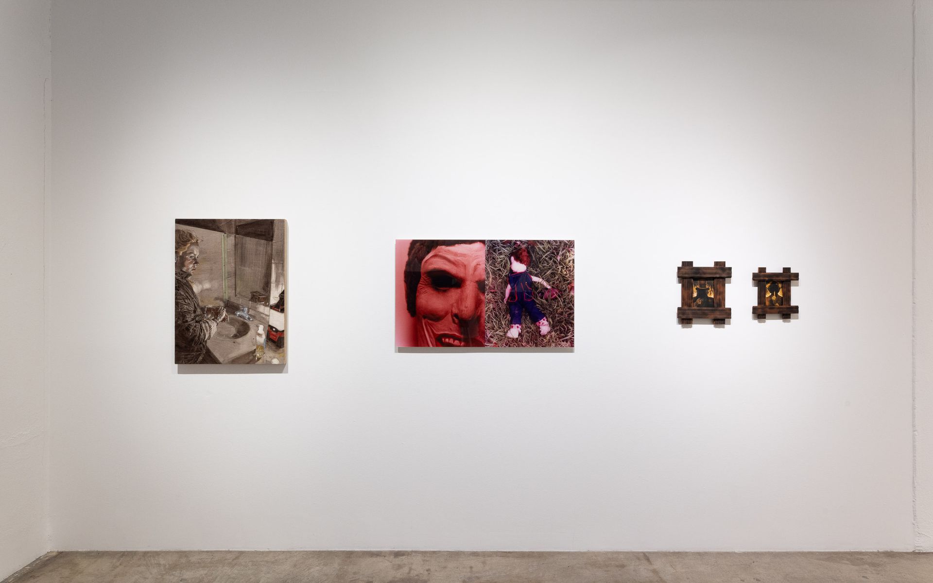 Gallery wall with three framed artworks: a sepia collage, a red-toned portrait, and two small matching pieces. Summer Bullet Sings, an exhibition of thirty-five artists organized by gallery director Sean Meredith and curator Diana Sardaryan.