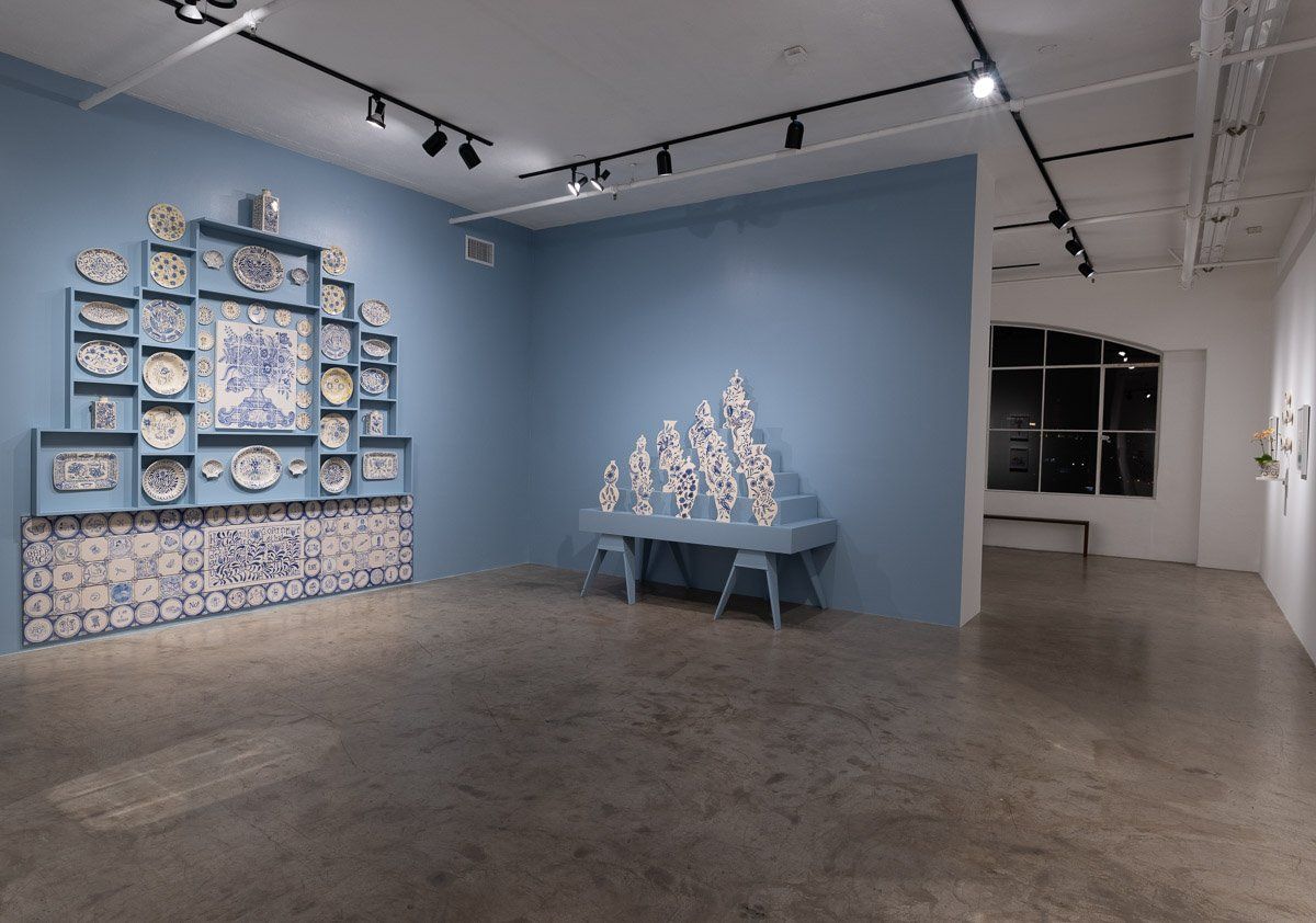 An empty room with a blue wall and a table