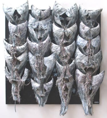 A bunch of skulls are stacked on top of each other