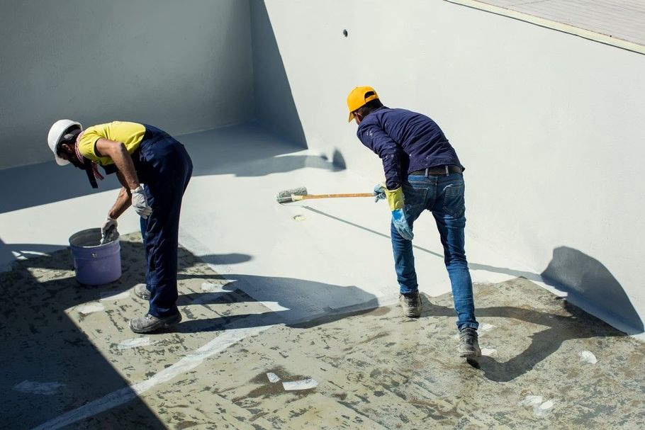 Garage floor epoxy flake installation process.