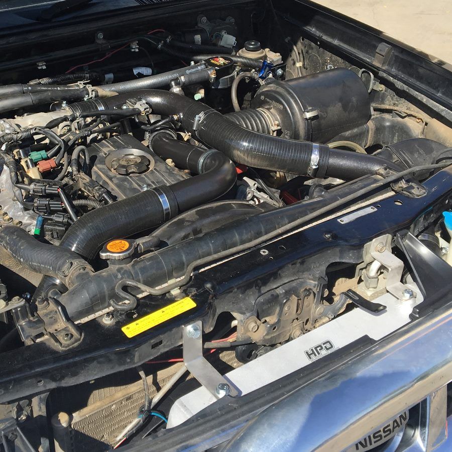 A Close Up Of A Nissan Engine With The Hood Open — Gympie Diesel & Dyno Centre in Glanmire, QLD