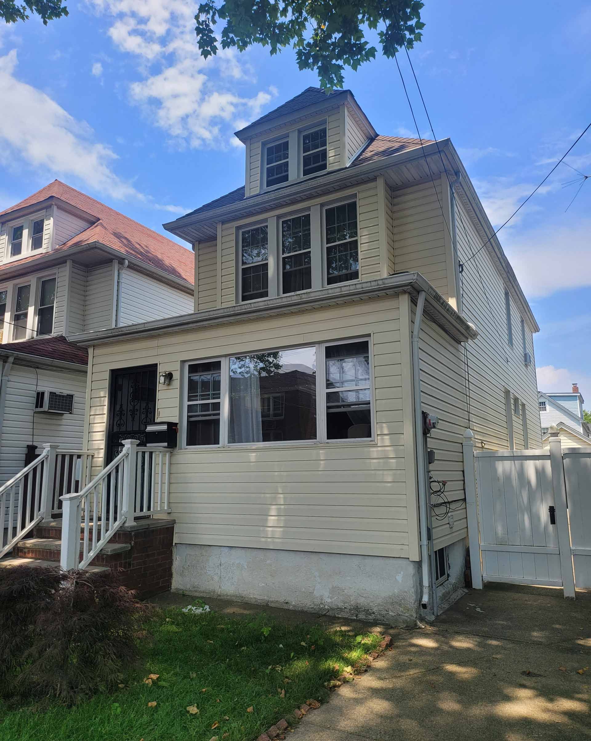 White House with a Lot of Windows and Stairs — Forest Hills, NY — Dix Realty