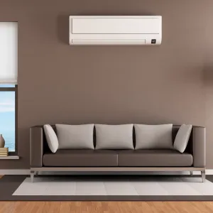 Happy Heating and Cooling LLC - A living room with a couch and air conditioner on the wall