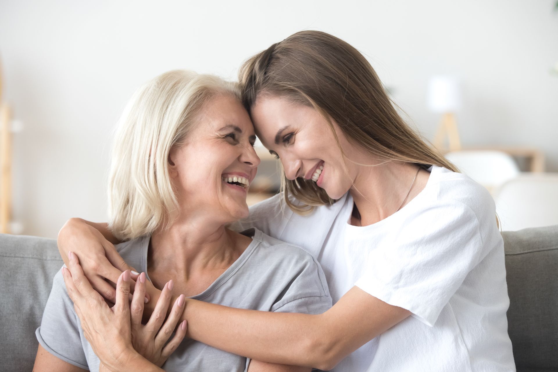 Woman embracing another woman