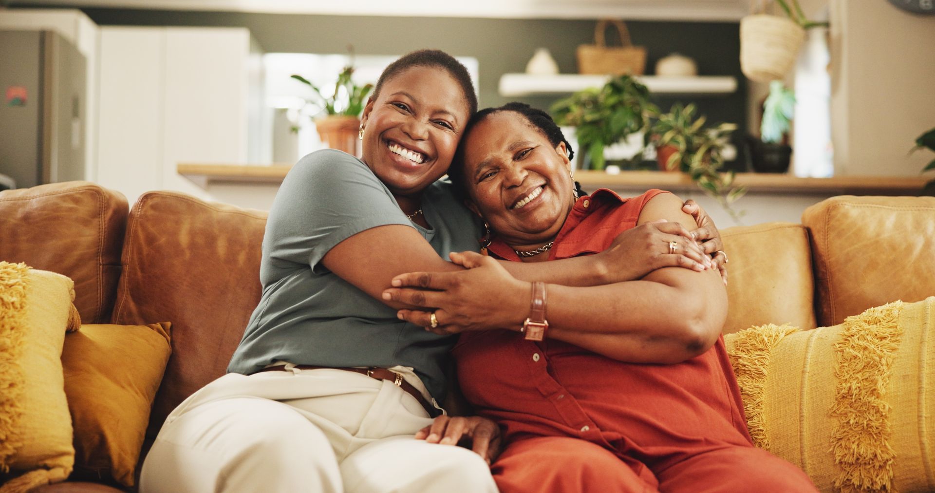 Two people embracing on a couch