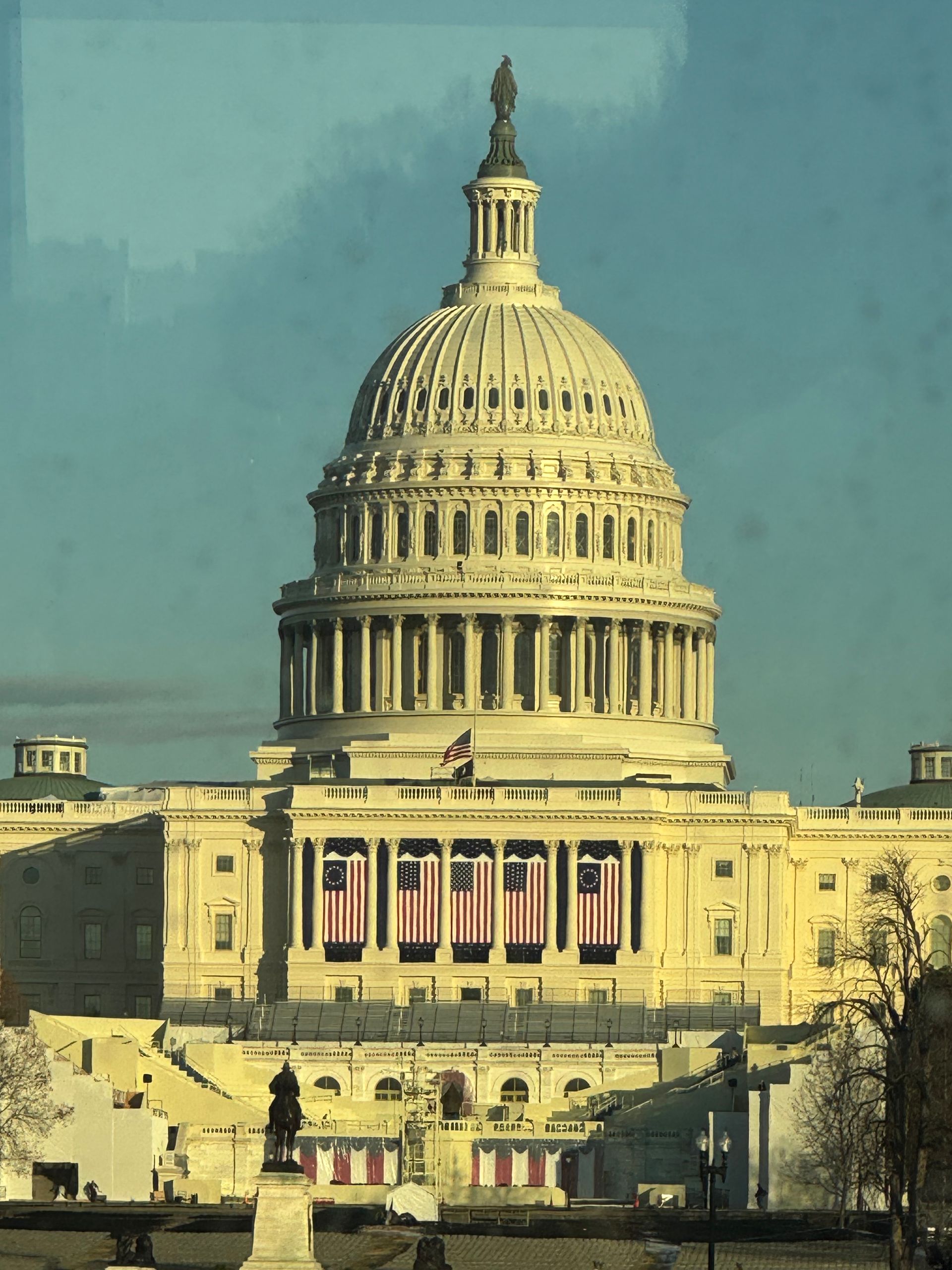 U.S. Capitol building in Washington, D.C., with the dome and statue against a blue sky