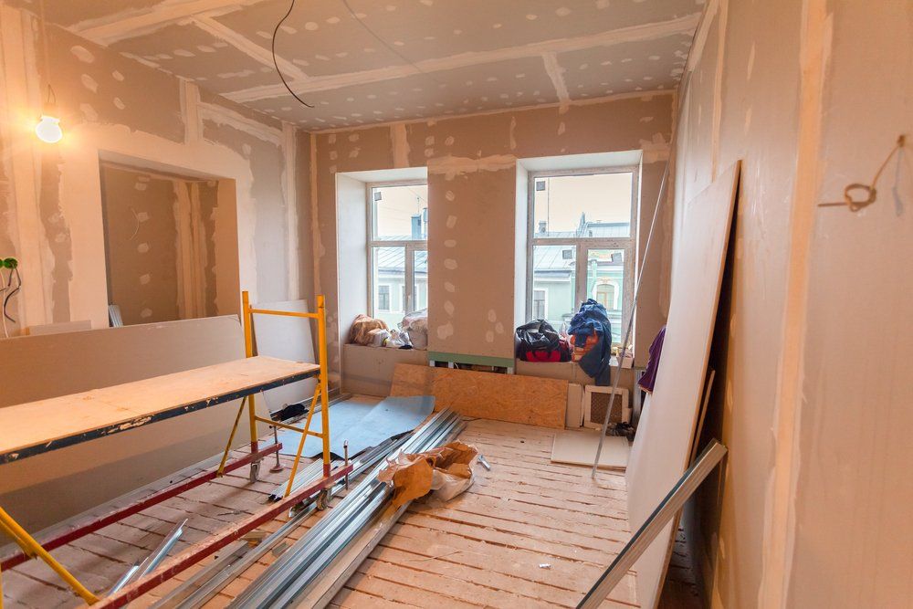 A room Under Construction with a Scaffolding and a table — New Homes in Wamberal, NSW