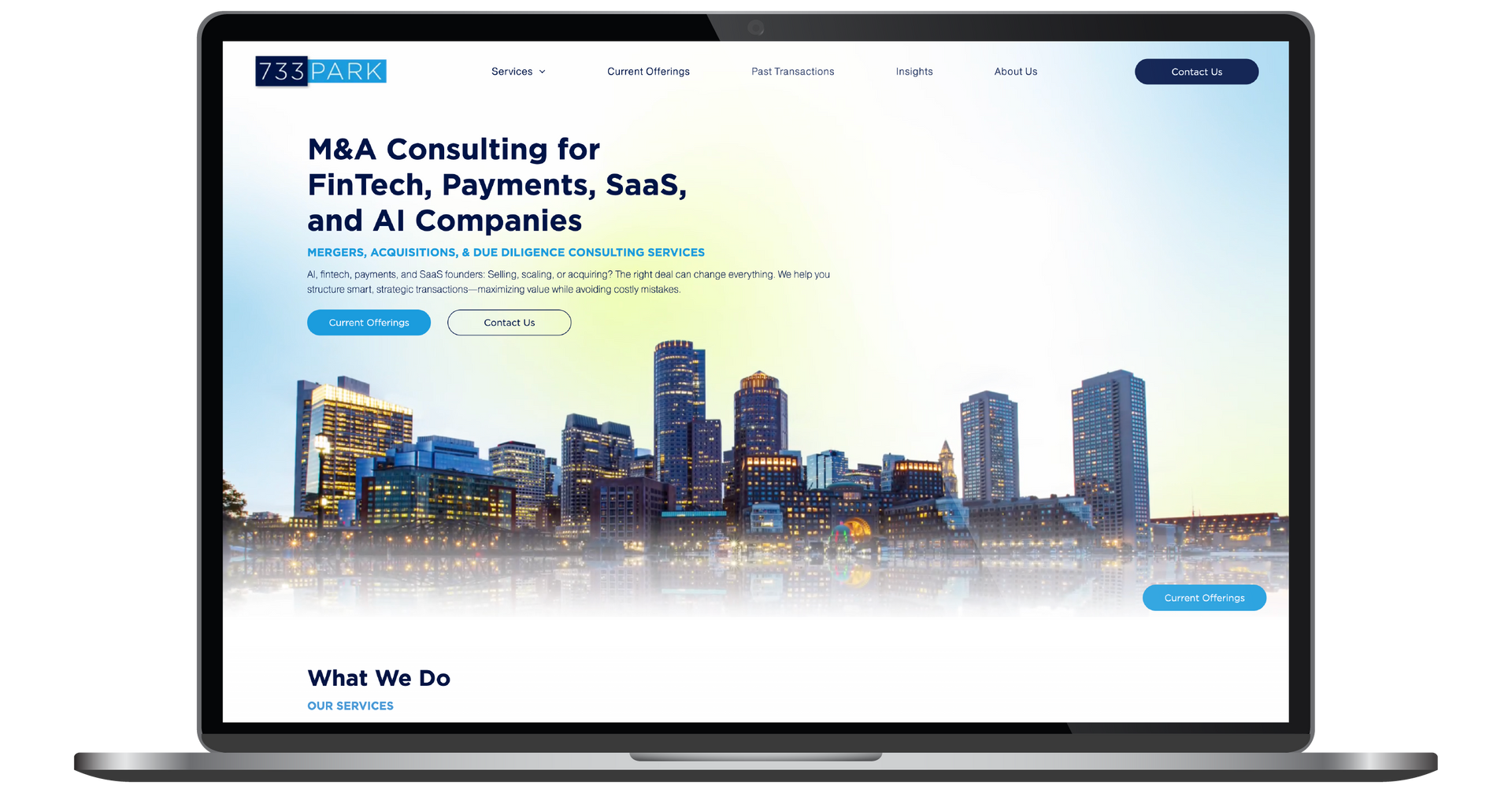 Laptop displaying a website for NBSA consulting with a city skyline hero image