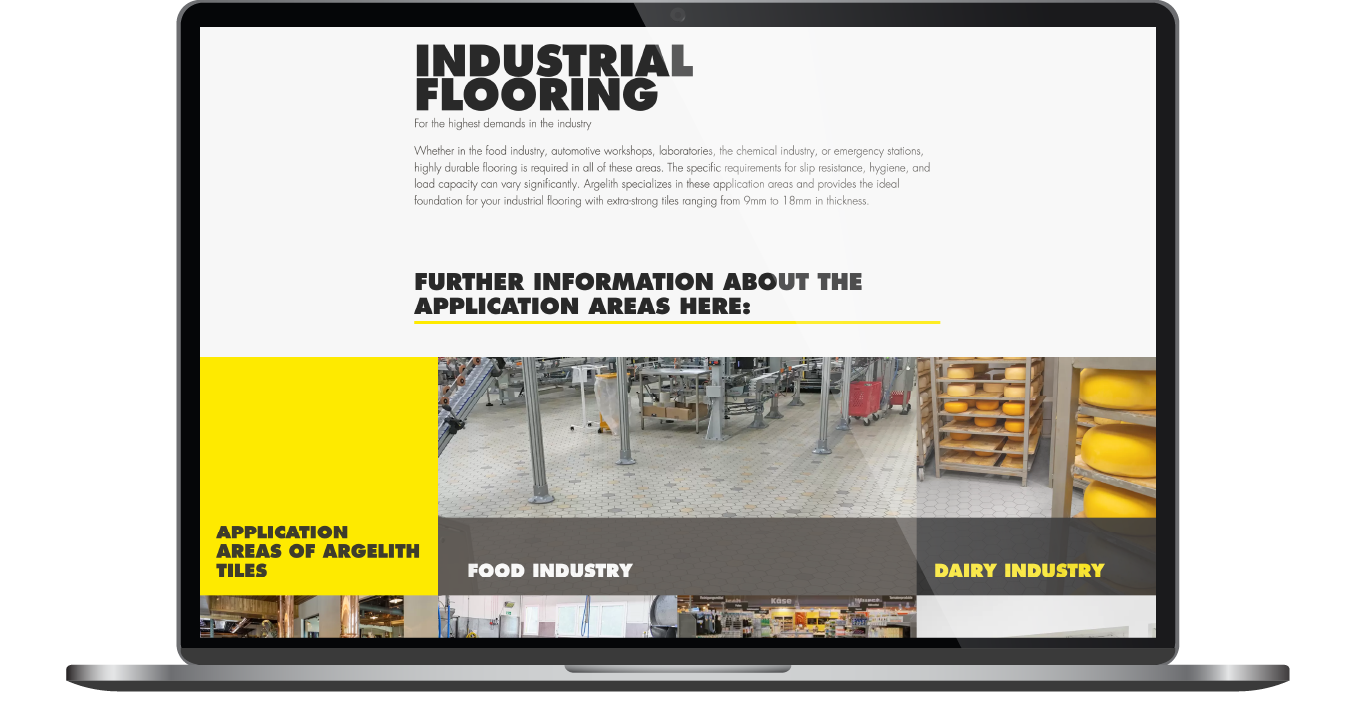 Laptop showing an industrial flooring website with bold black-and-yellow layout and warehouse photos
